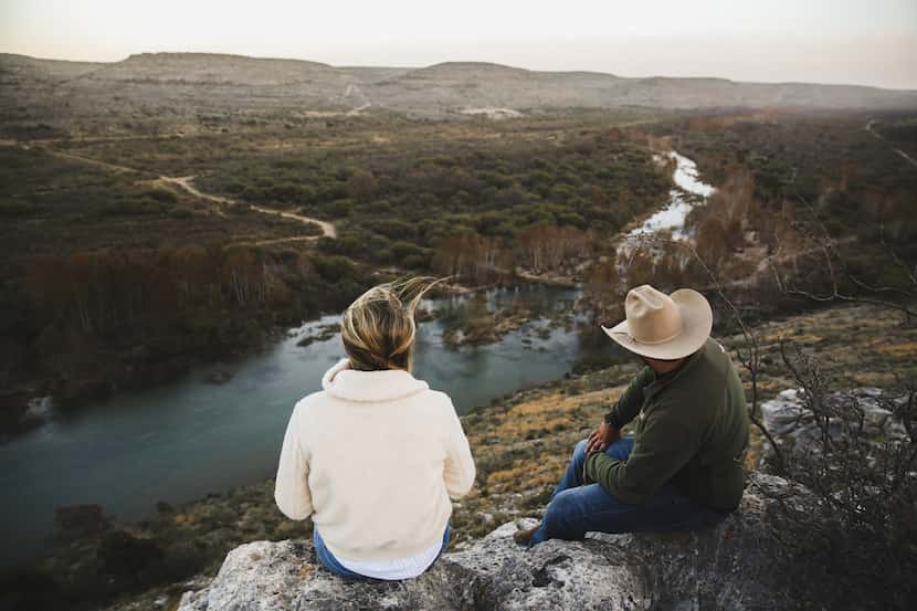 Hikers enjoy a scenic overlook at Hudspeth River Ranch near Comstock, Texas, one of eight...
