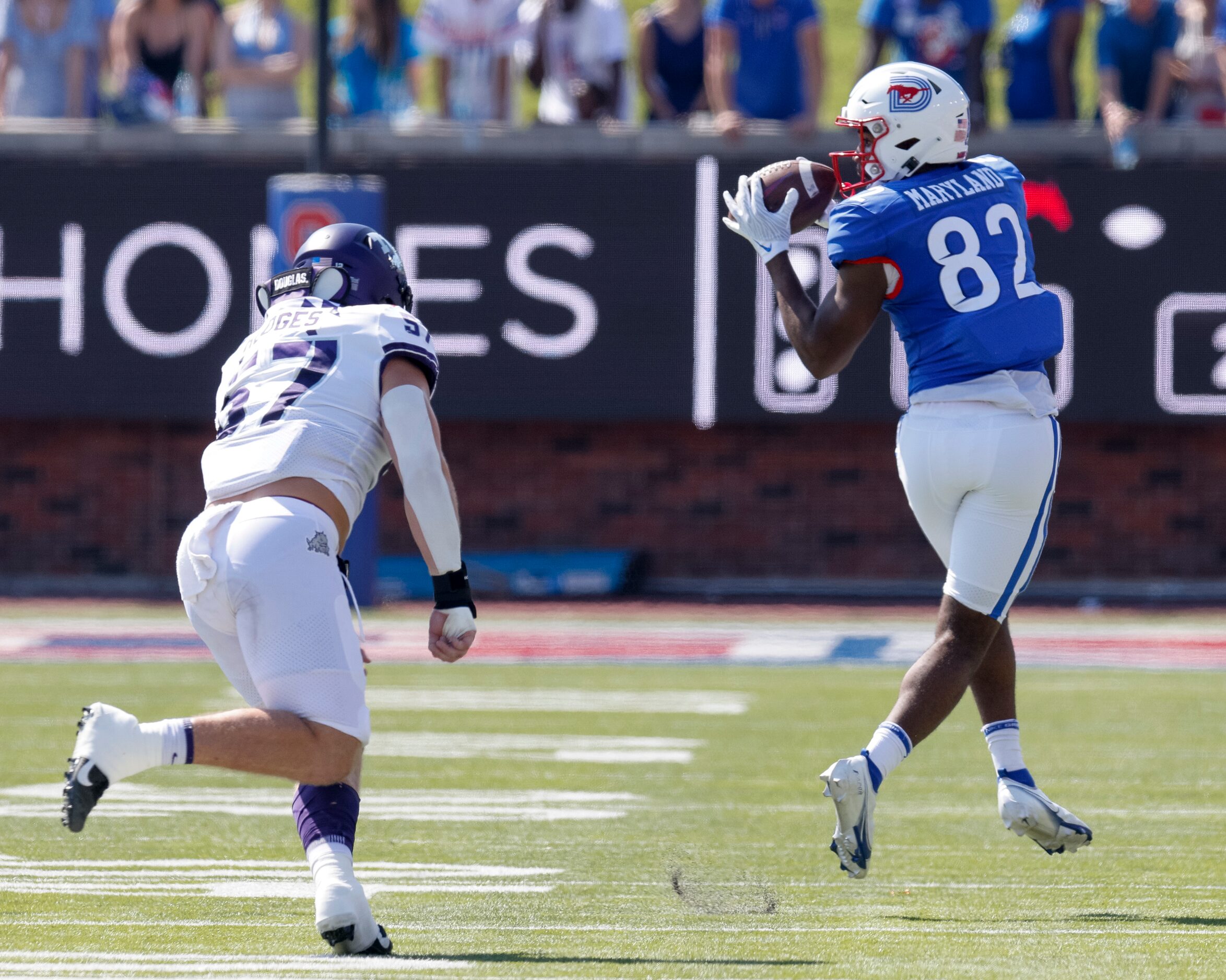 SMU tight end RJ Maryland (82) catches a pass ahead of TCU linebacker Johnny Hodges (57)...