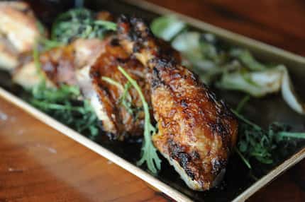 The rotisserie chicken is tea brined, spit roasted over pecan wood and served with sweet...