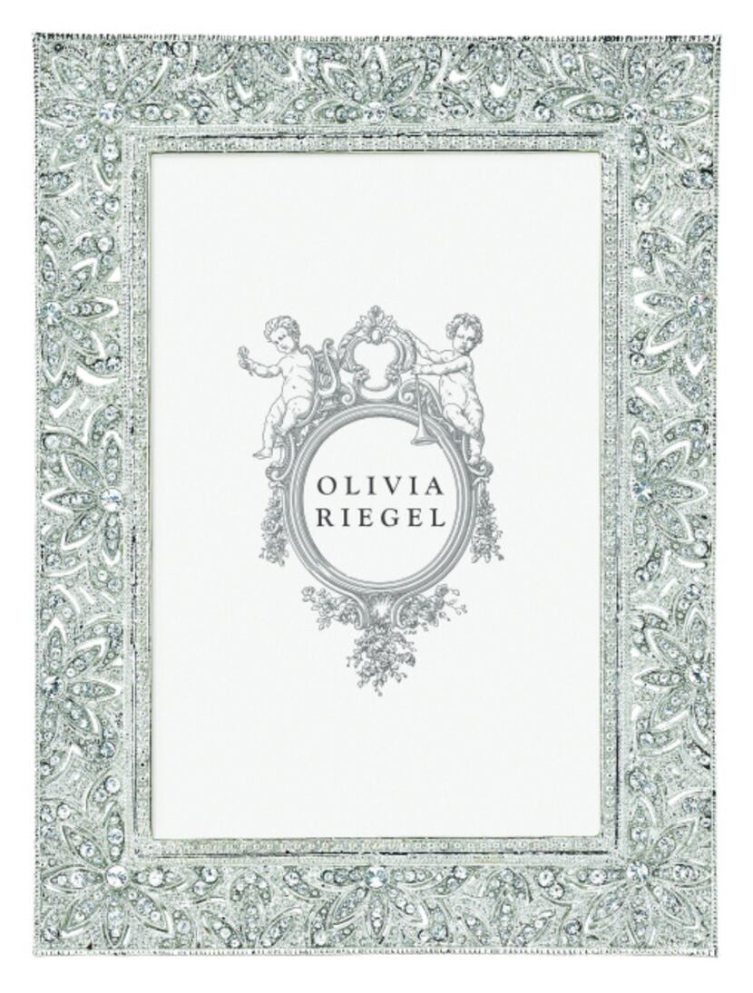 An elegant photo frame inspired by estate jewelry is from local manufacturer Olivia Riegel....