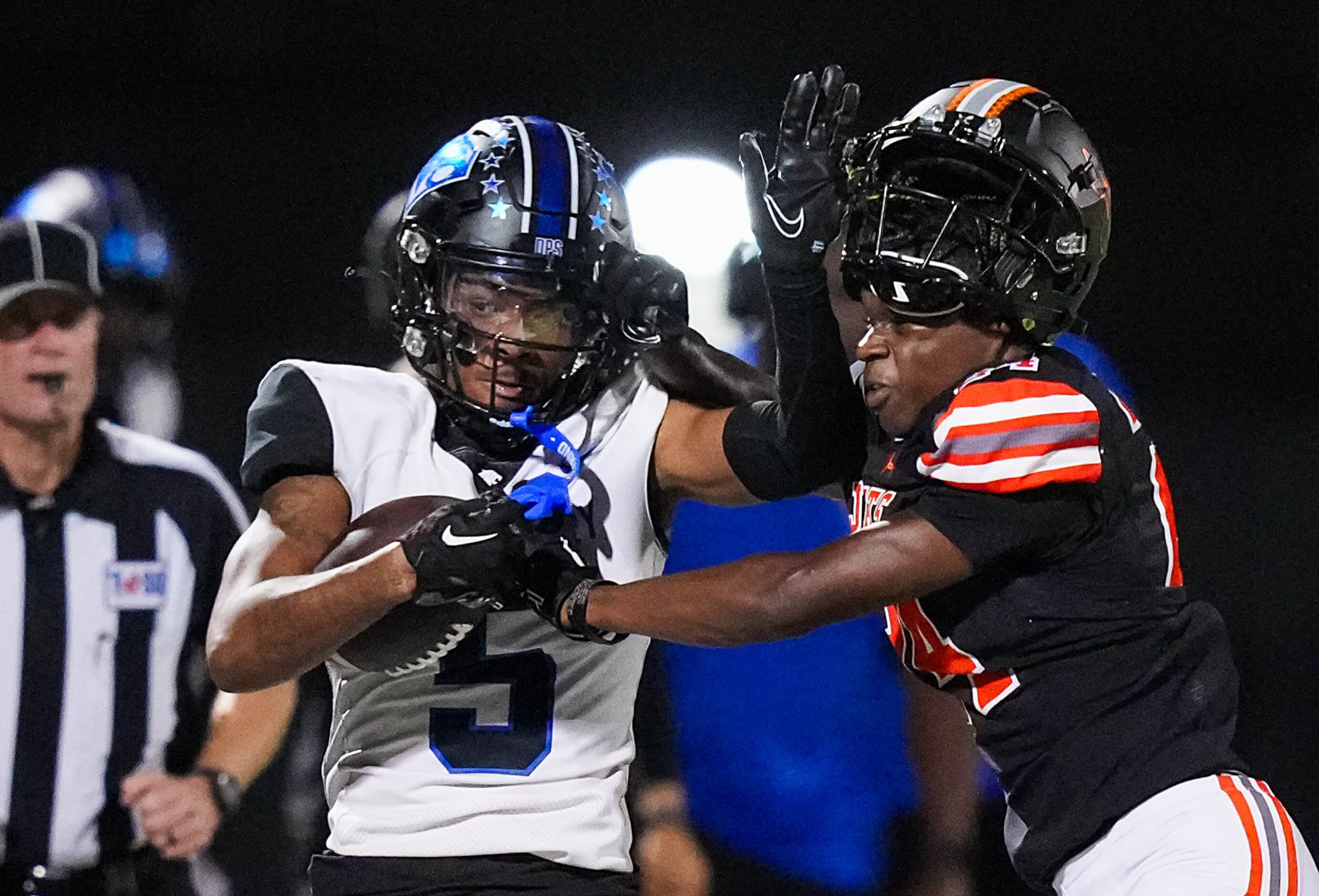 Rockwall defensive back AJ Brown (24) loses his helmet as he pushes North Crowley running...