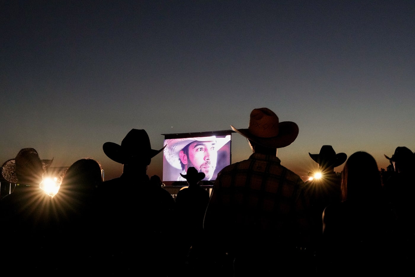 Adan Banuelos is seen on screen as guests watch a screening of the short film Windows to the...