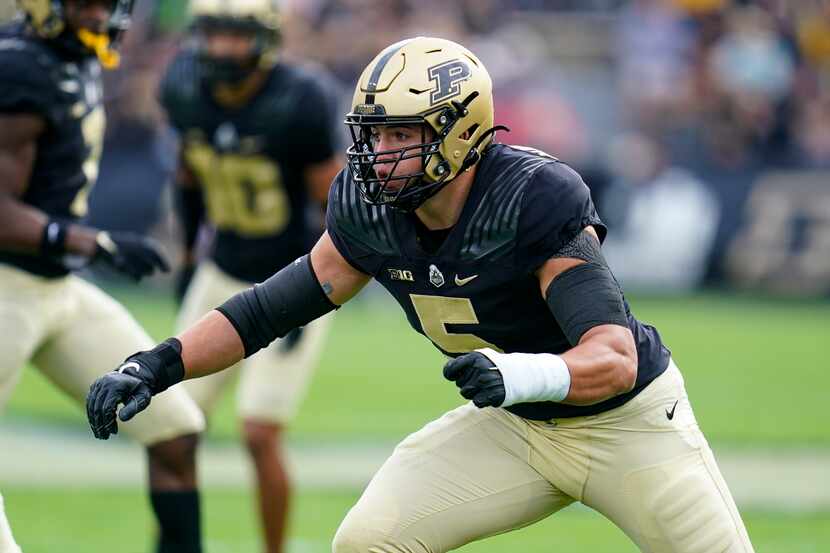 Purdue defensive end George Karlaftis (5) plays against Wisconsin during the first half of...
