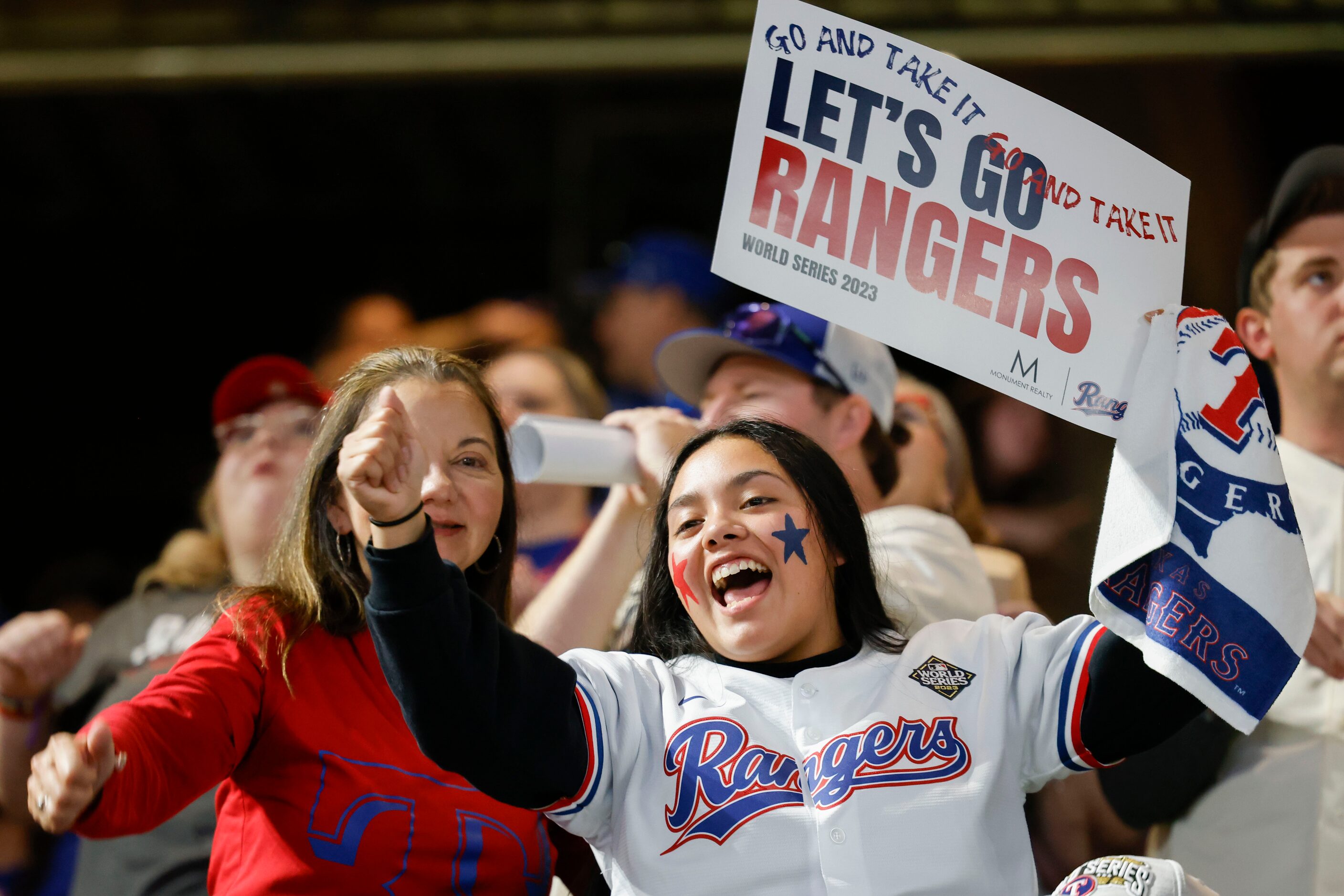 Chachy Bamaca (right) of Arlington cheers ahead of a World Series Game 5 watch party at...