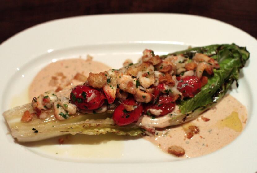 On the regular menu, a grilled hearts of romaine salad, rubbed with charred lemon then...