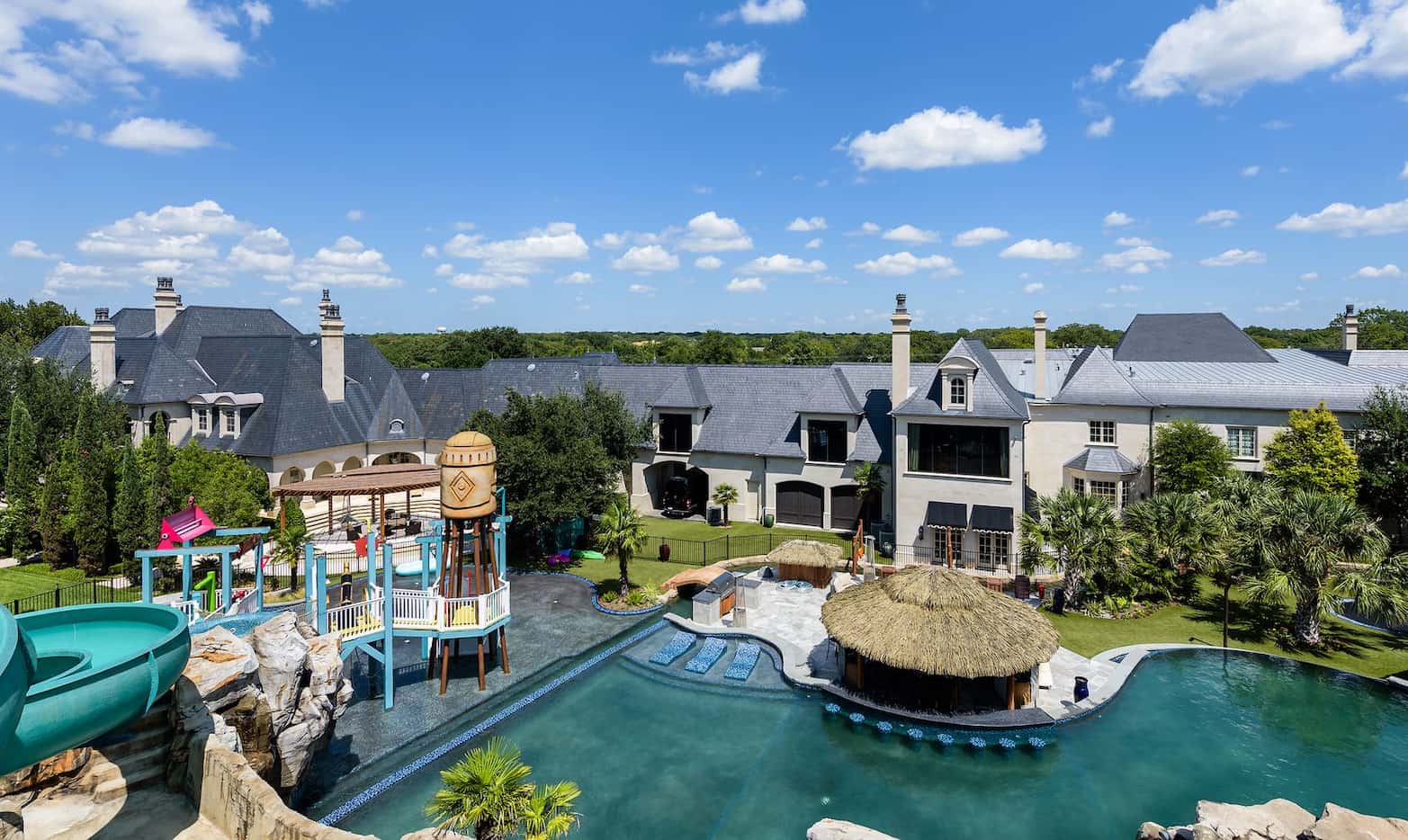 The more than four acre Preston Hollow estate has its own waterpark.