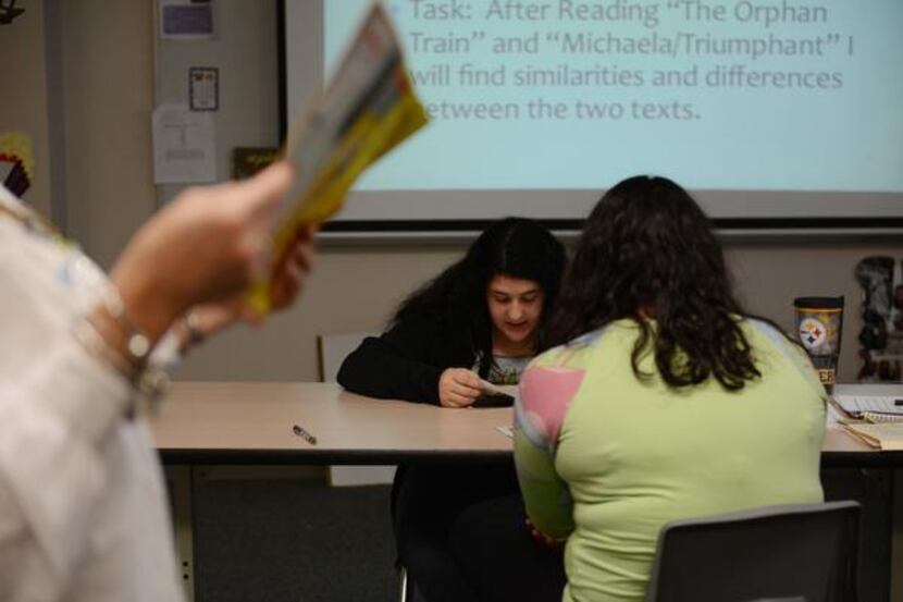 
Seventh-grader Marissa Linder reads an article out loud during "Cain Time", when teachers...