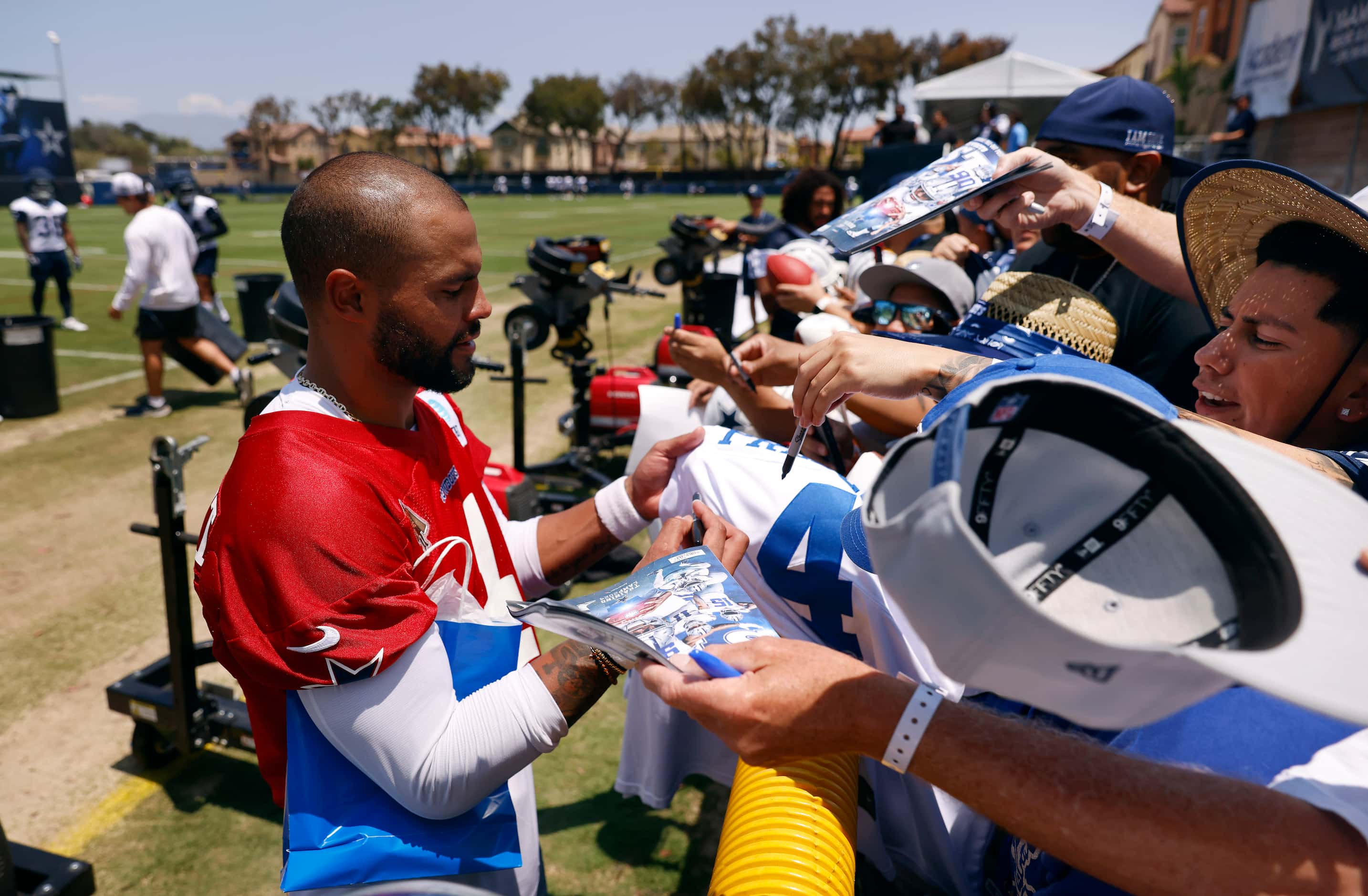 Dallas Cowboys quarterback Dak Prescott (4) signs autographs for fans following the  opening...