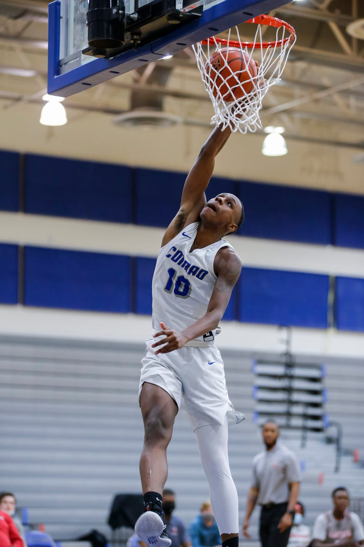 Conrad senior forward Kerric Saunders (10) dunks during a high school basketball game...