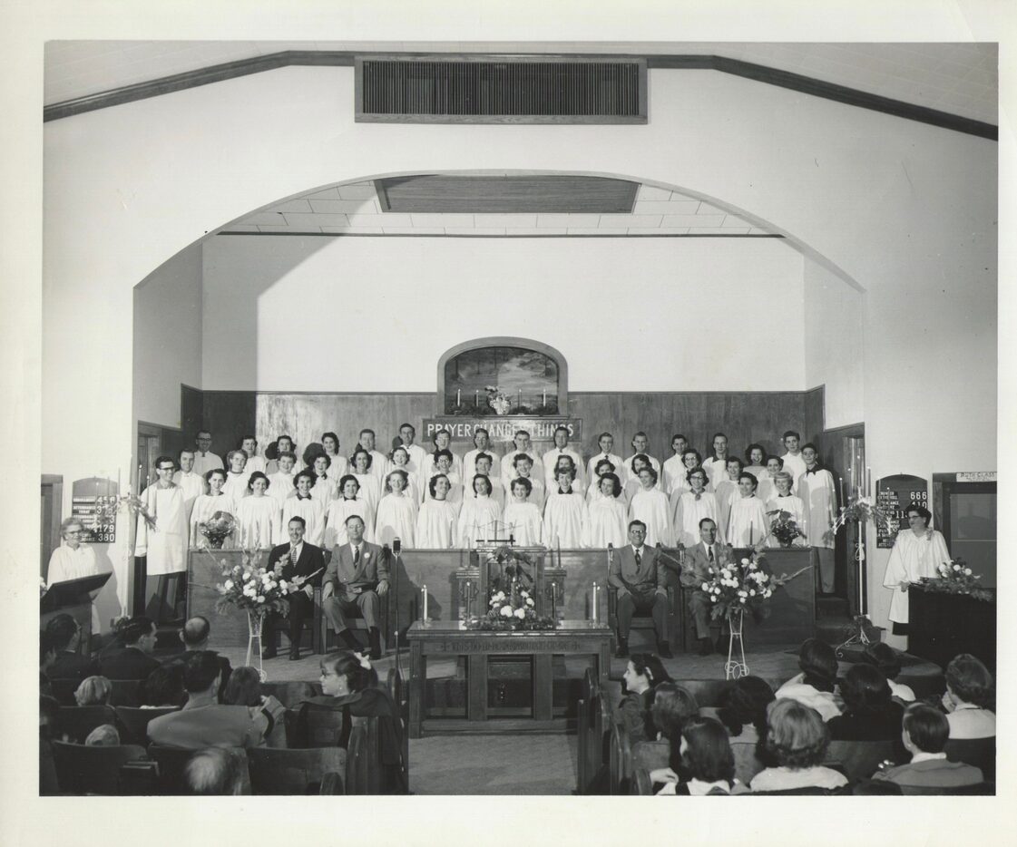 That's Sam Dennis' father, Delmar Samuel Dennis, standing next to the "P" in the "Prayer...