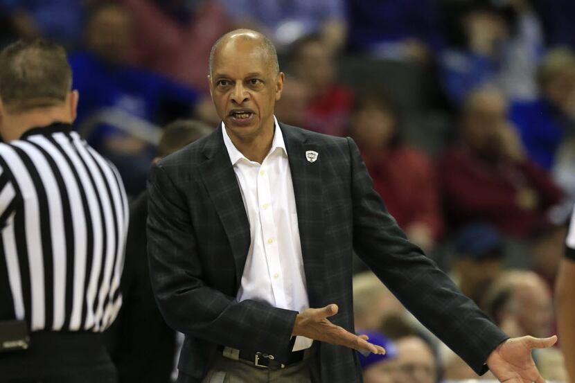 TCU head coach Trent Johnson asks for a call from a game official during the first half of...