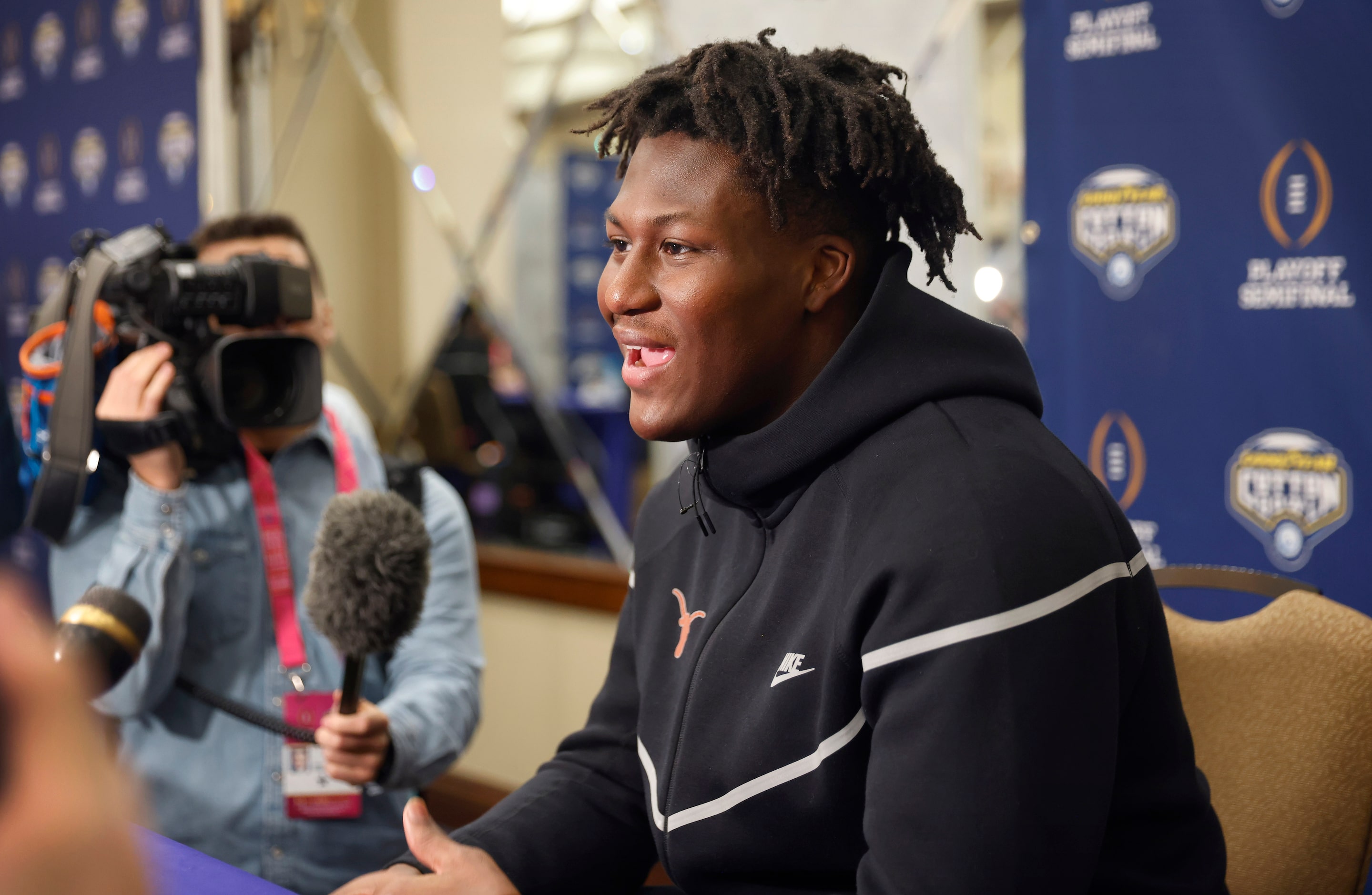 Texas Longhorns linebacker Anthony Hill Jr. of Denton answers questions from the media...