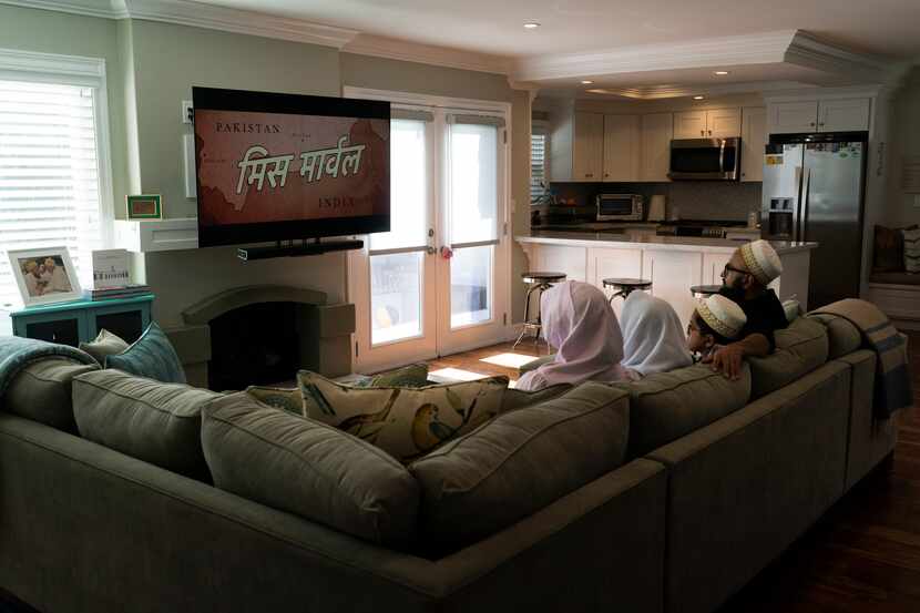 The Zakir family watch an episode of "Ms. Marvel" in Anaheim, Calif., Friday, July 8, 2022....