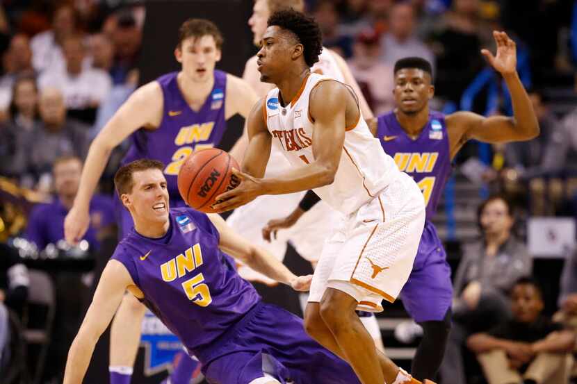 Texas Longhorns guard Isaiah Taylor (1) is fouled by Northern Iowa Panthers guard Matt...