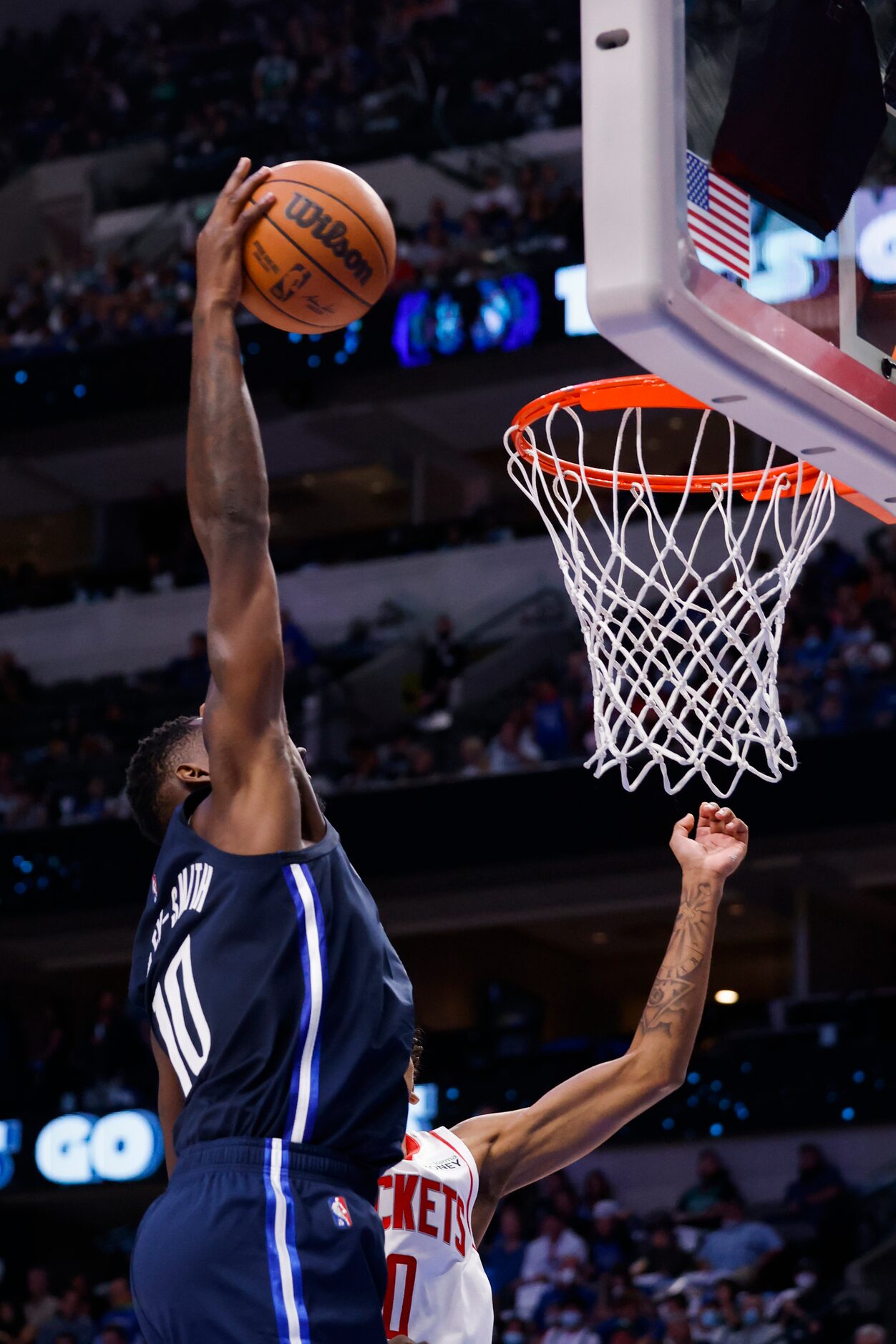 Dallas Mavericks forward Dorian Finney-Smith (10) goes for a layup during the fourth quarter...