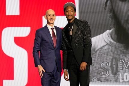 Ron Holland II, right, poses for a photo with NBA commissioner Adam Silver after being...