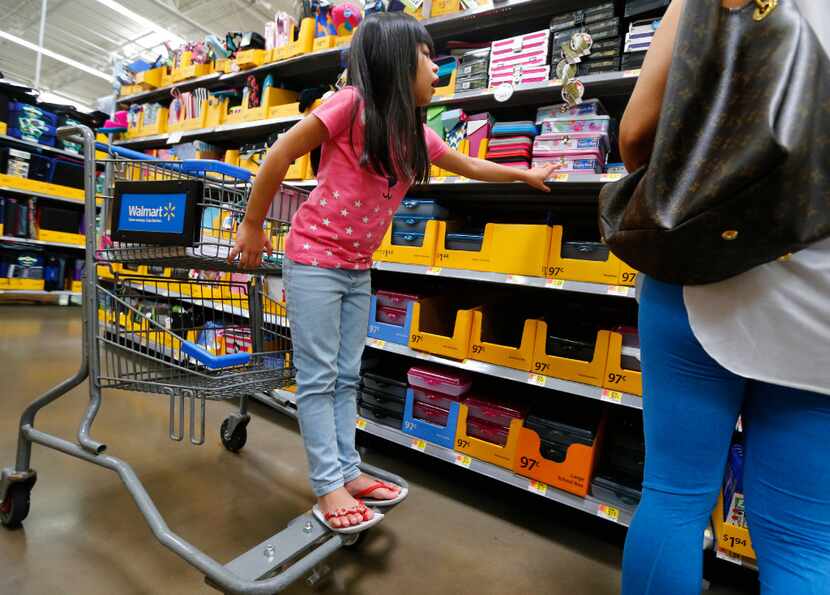 Isis Pangelinan shops for back-to-school materials at Walmart at Timber Creek Crossing in...