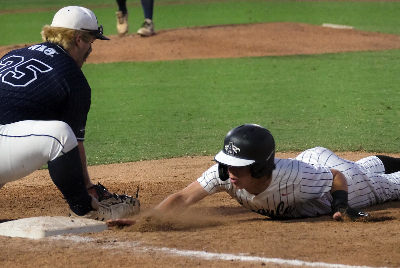 Argyle Grady Emerson, (1), makes it back to the first base bag before  Boerne Champion Nic...