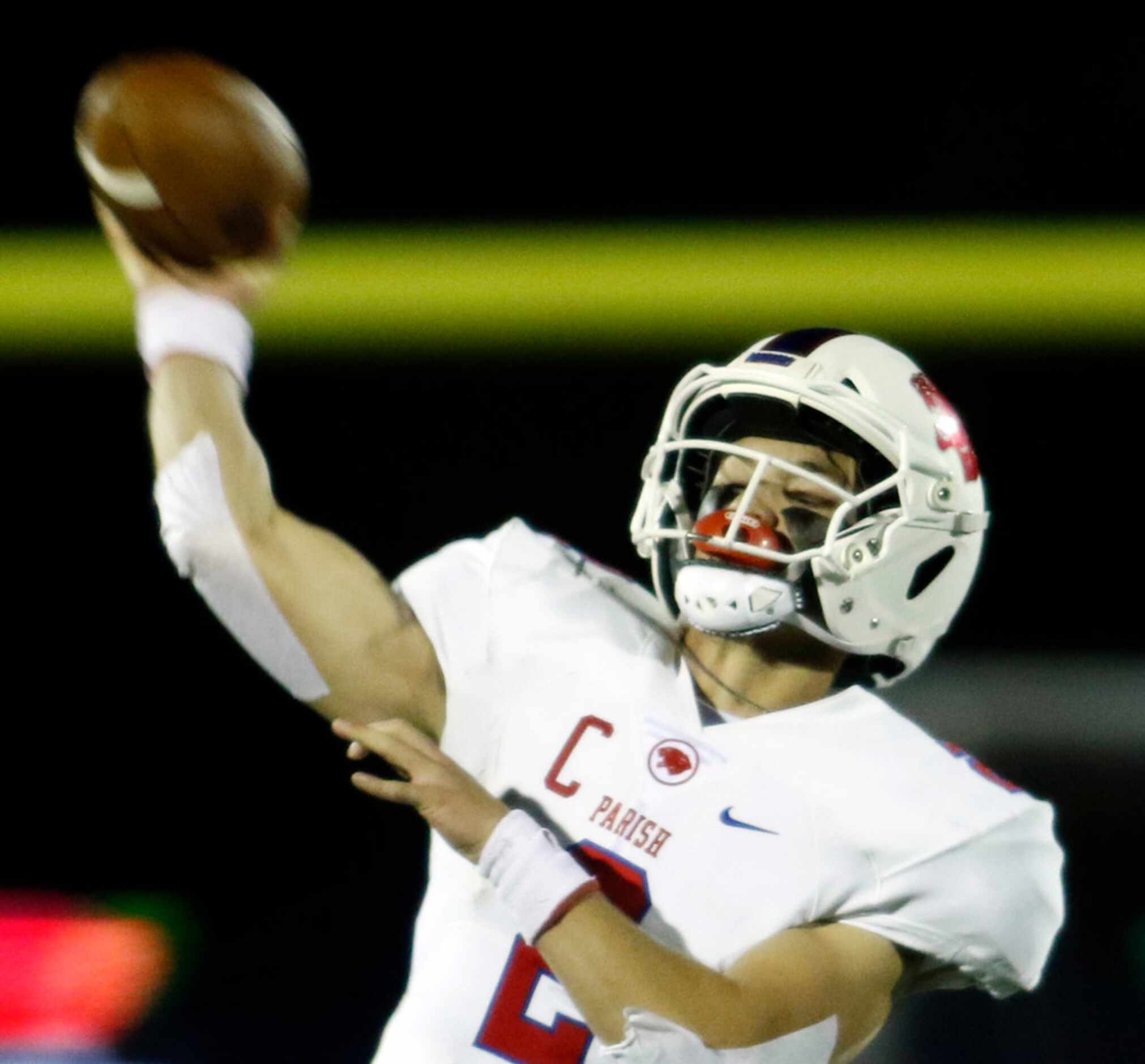 Parish Episcopal quarterback Preston Stone (2) launches a long pass downfield during second...