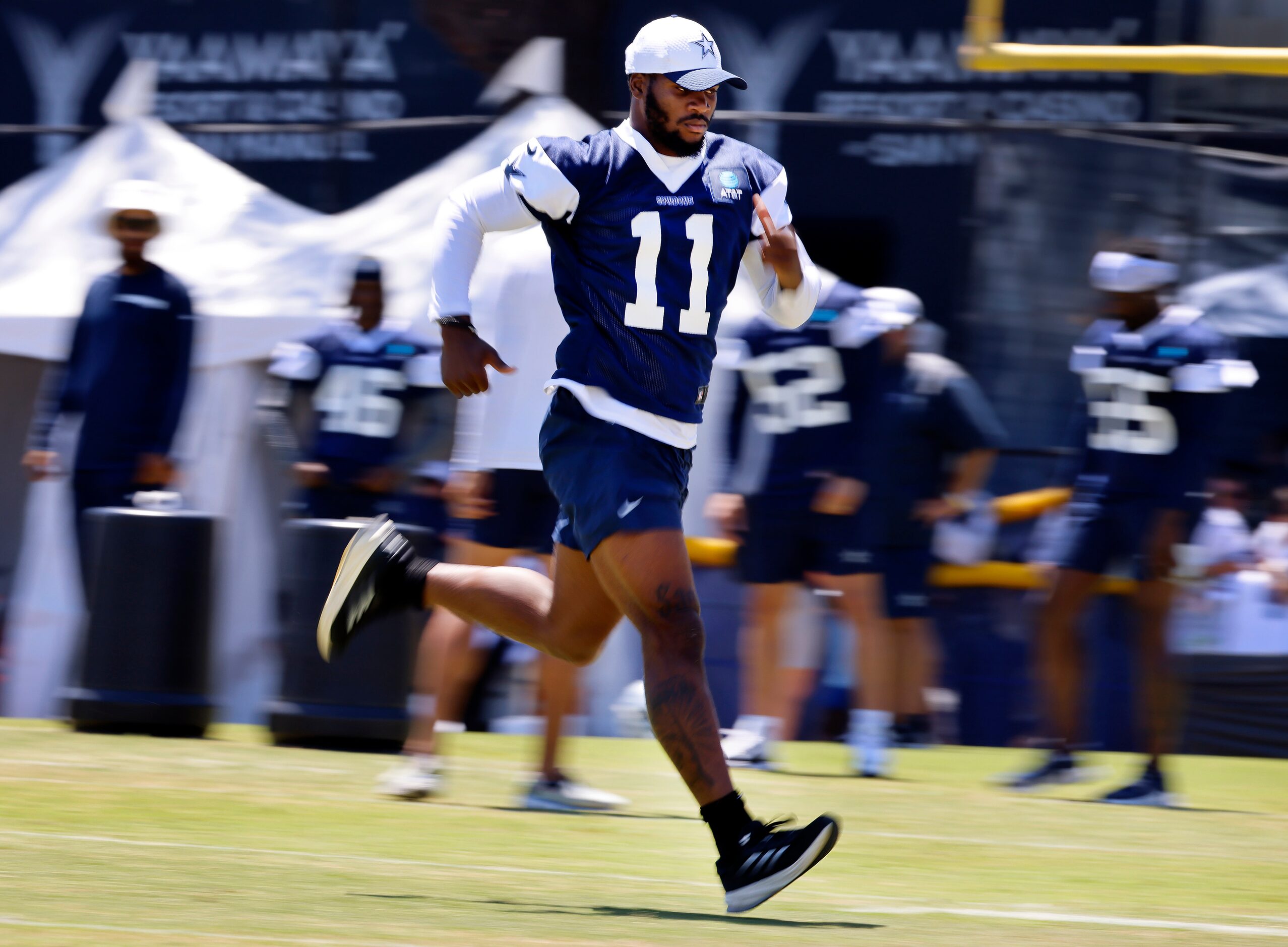 Dallas Cowboys linebacker Micah Parsons (11) runs sprints across the field following a mock...