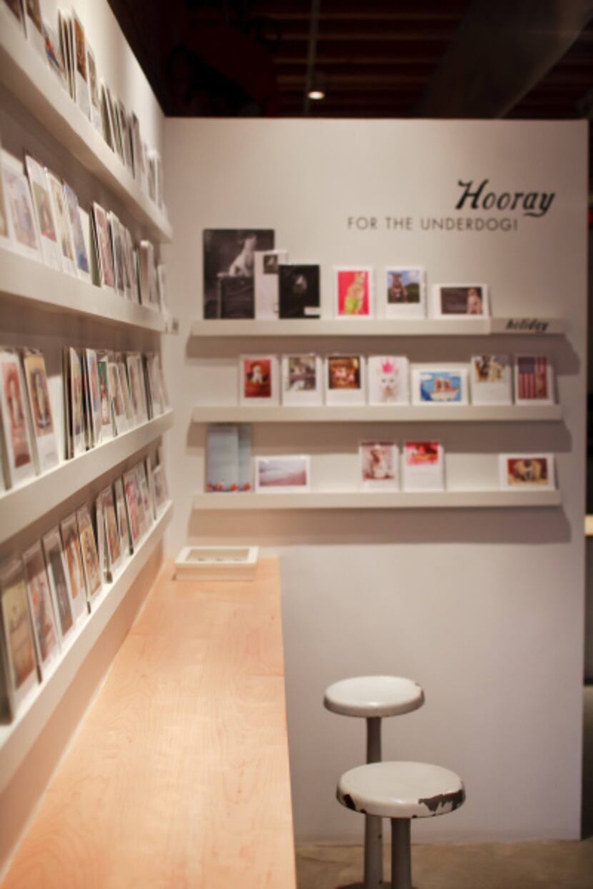The first-floor entry serves double duty as greeting card shop and gallery for framed photos.