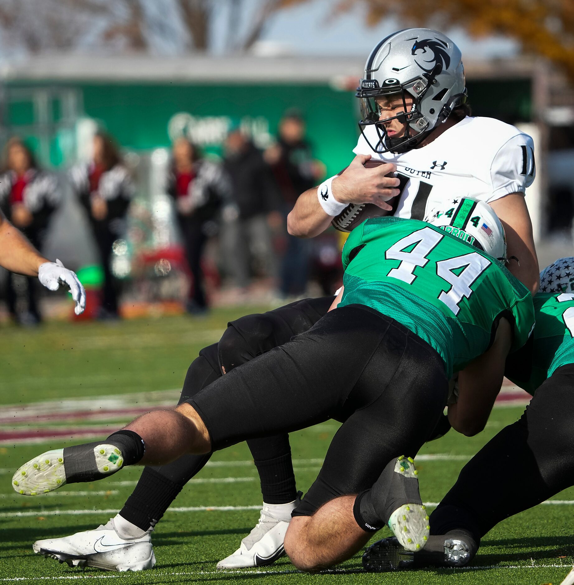 Denton Guyer quarterback Jackson Arnold (11) is brought down by Southlake Carroll defensive...