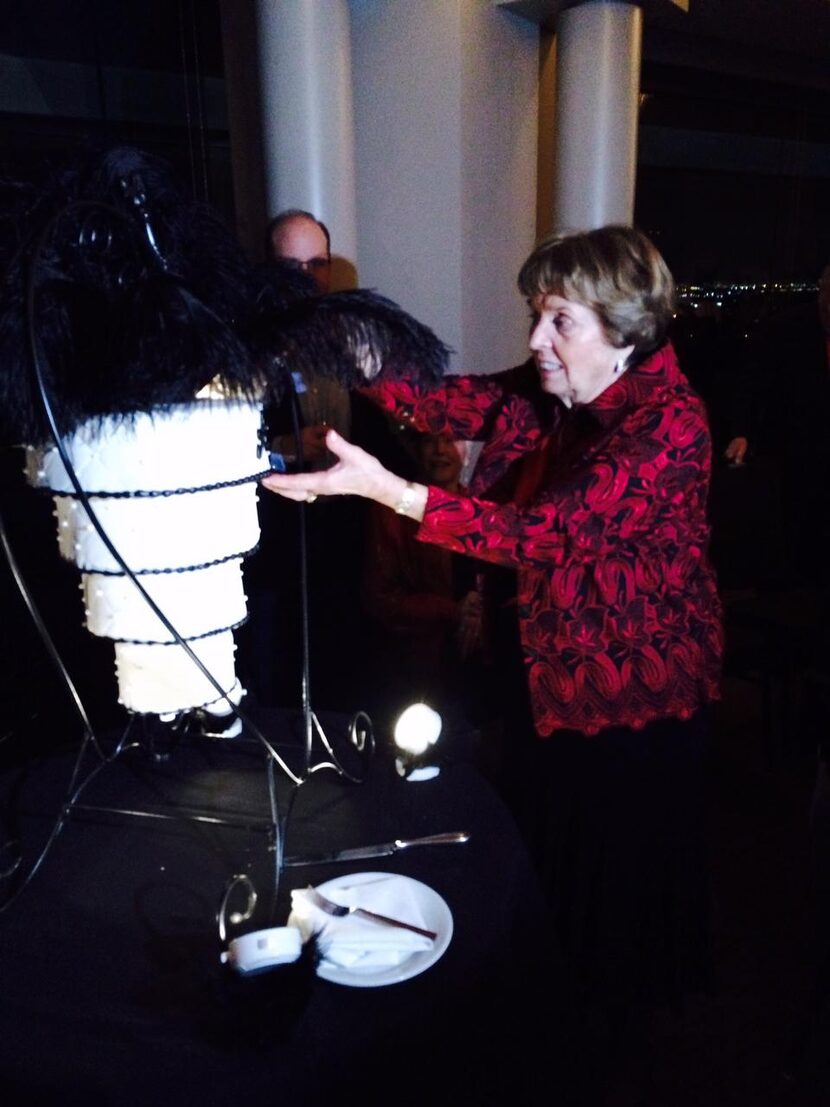 
Anne Pfaff cuts her 80th birthday cake at La Cima Club in Irving.
