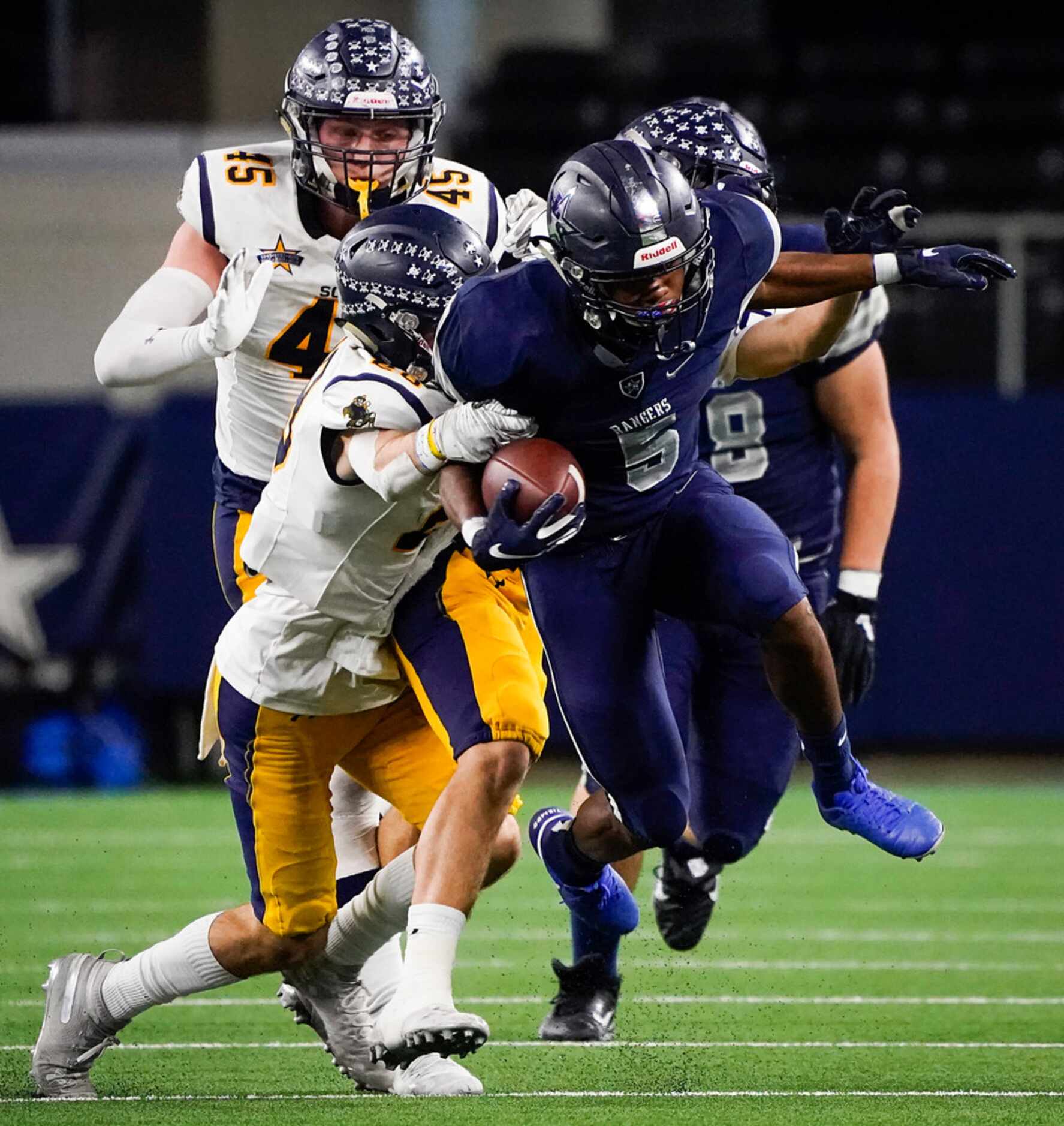 Frisco Lone Star running back Jaden Nixon (5) is brought down by the Highland Park defense...