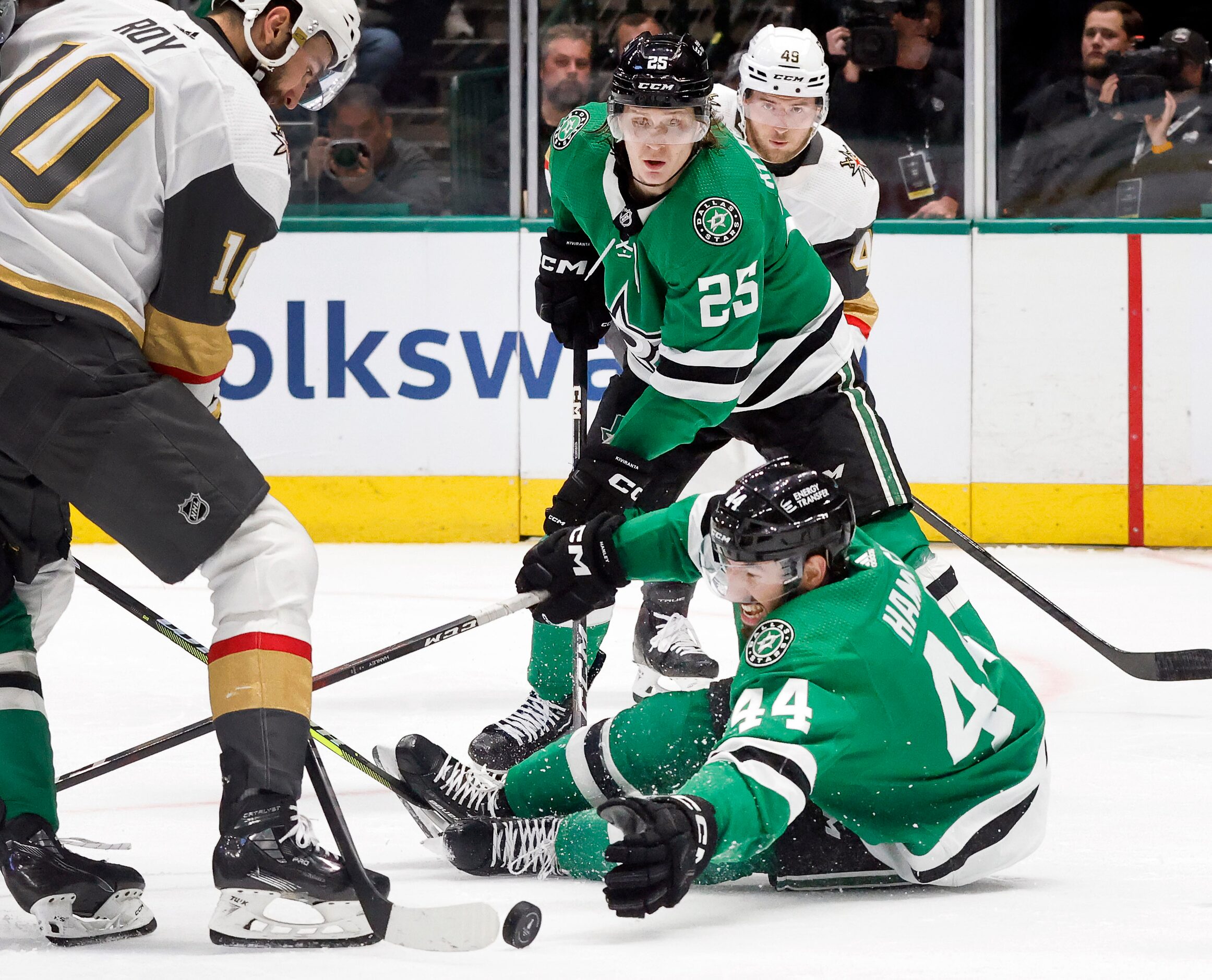 Dallas Stars defenseman Joel Hanley (44) dives for a loose puck as Vegas Golden Knights...