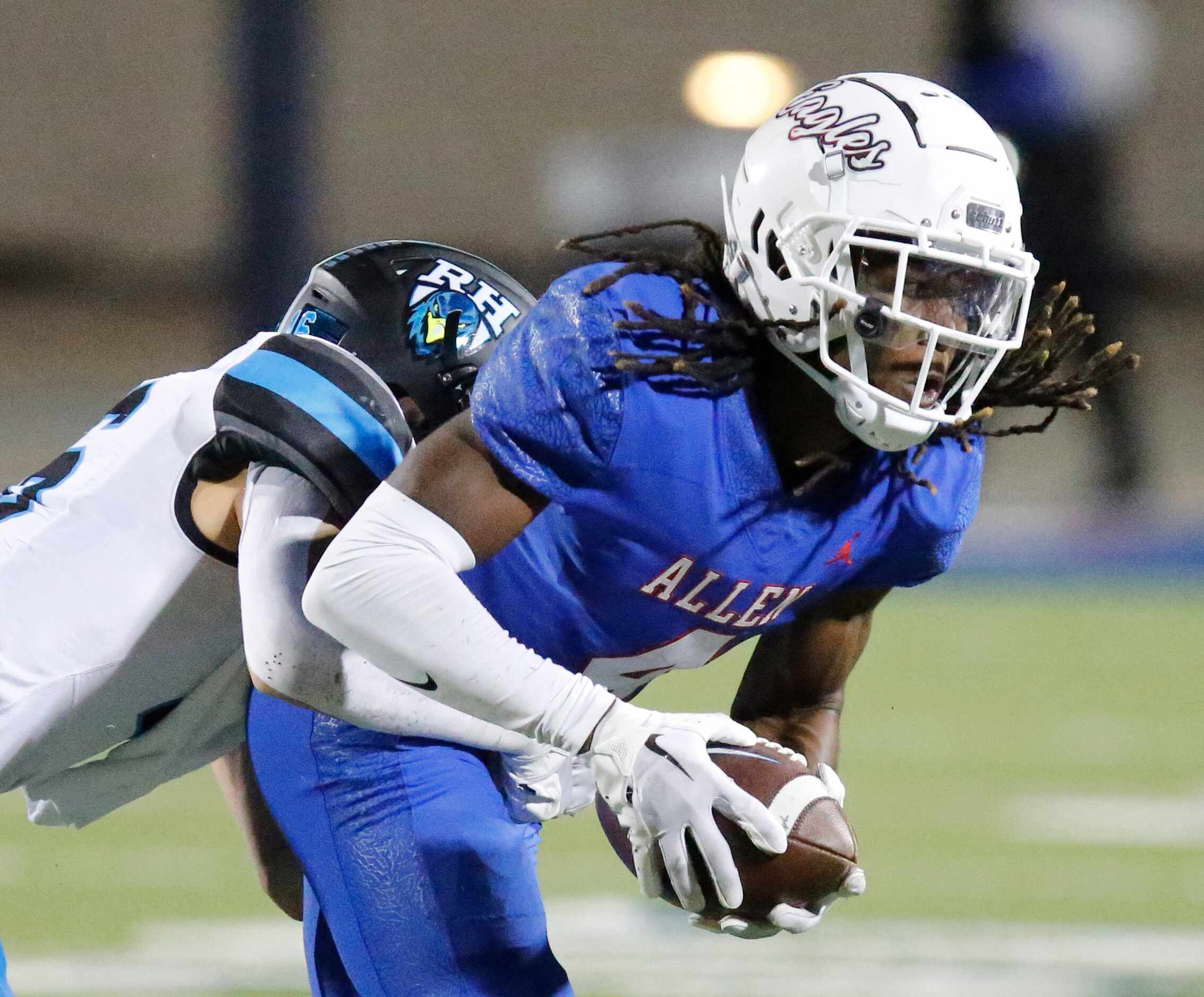 Allen High School wide receiver Messiah Washington (4) IS tackled after a catch during the...