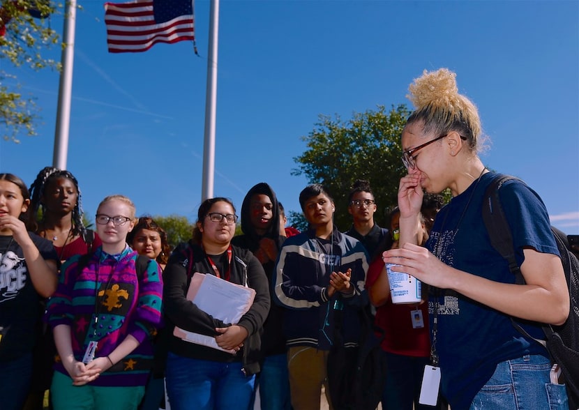 Junior Kealie Jordan (right) led her classmates in a sometimes emotional walkout at...