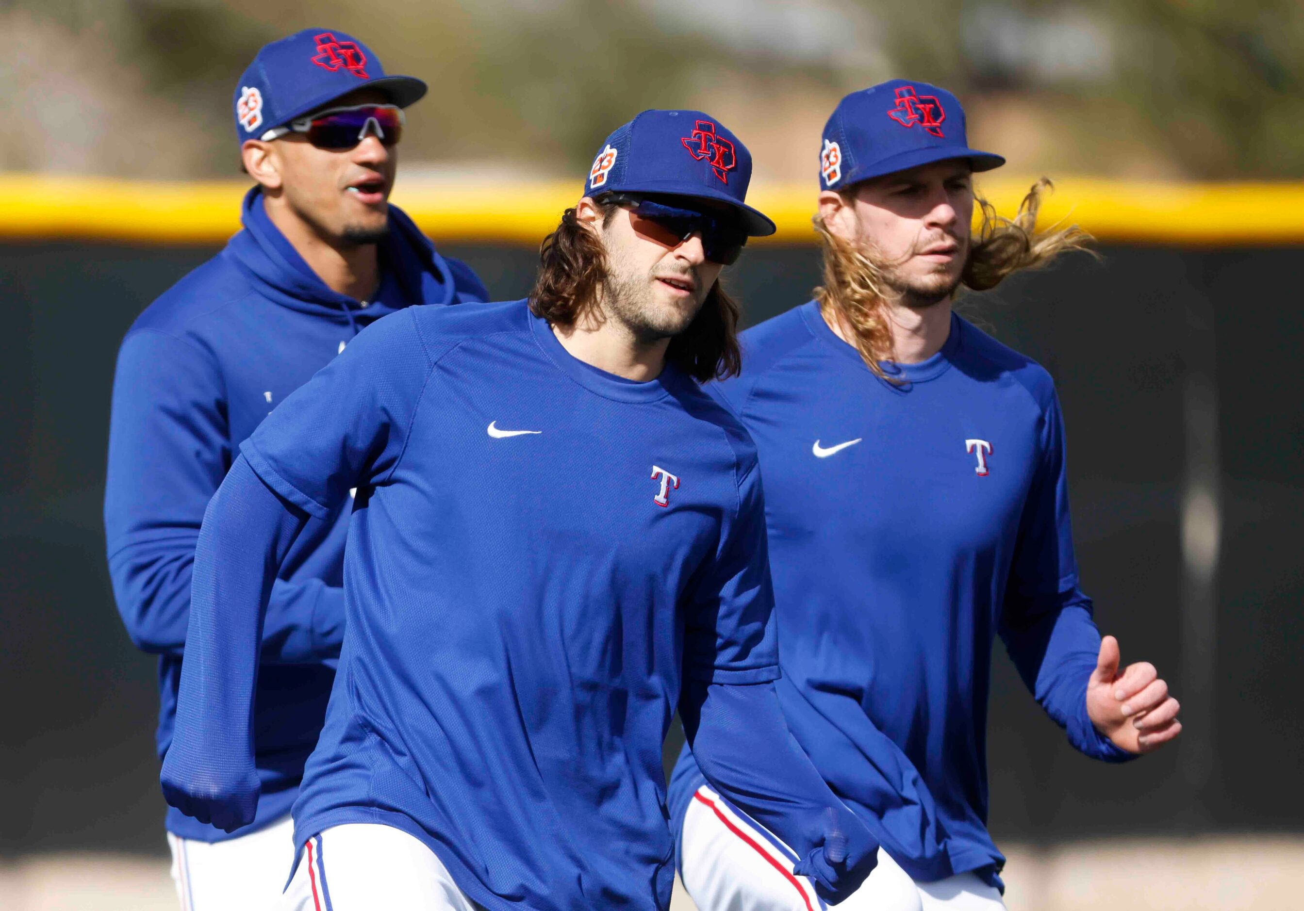 Texas Rangers outfielder Bubba Thompson, left, infielder Josh Smith, center, and outfielder...