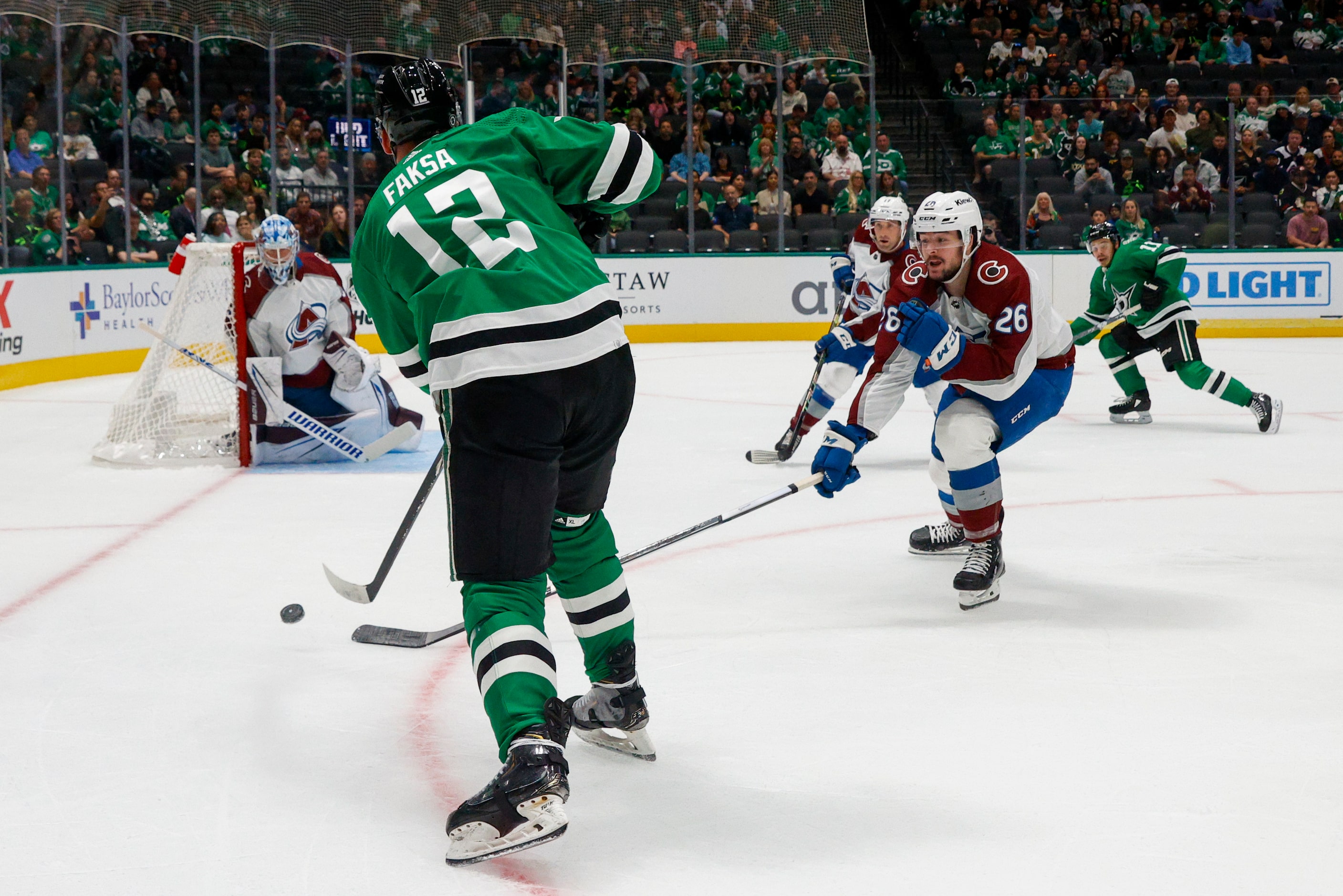 Dallas Stars center Radek Faksa (12) shoots the puck towards goal during the first period of...