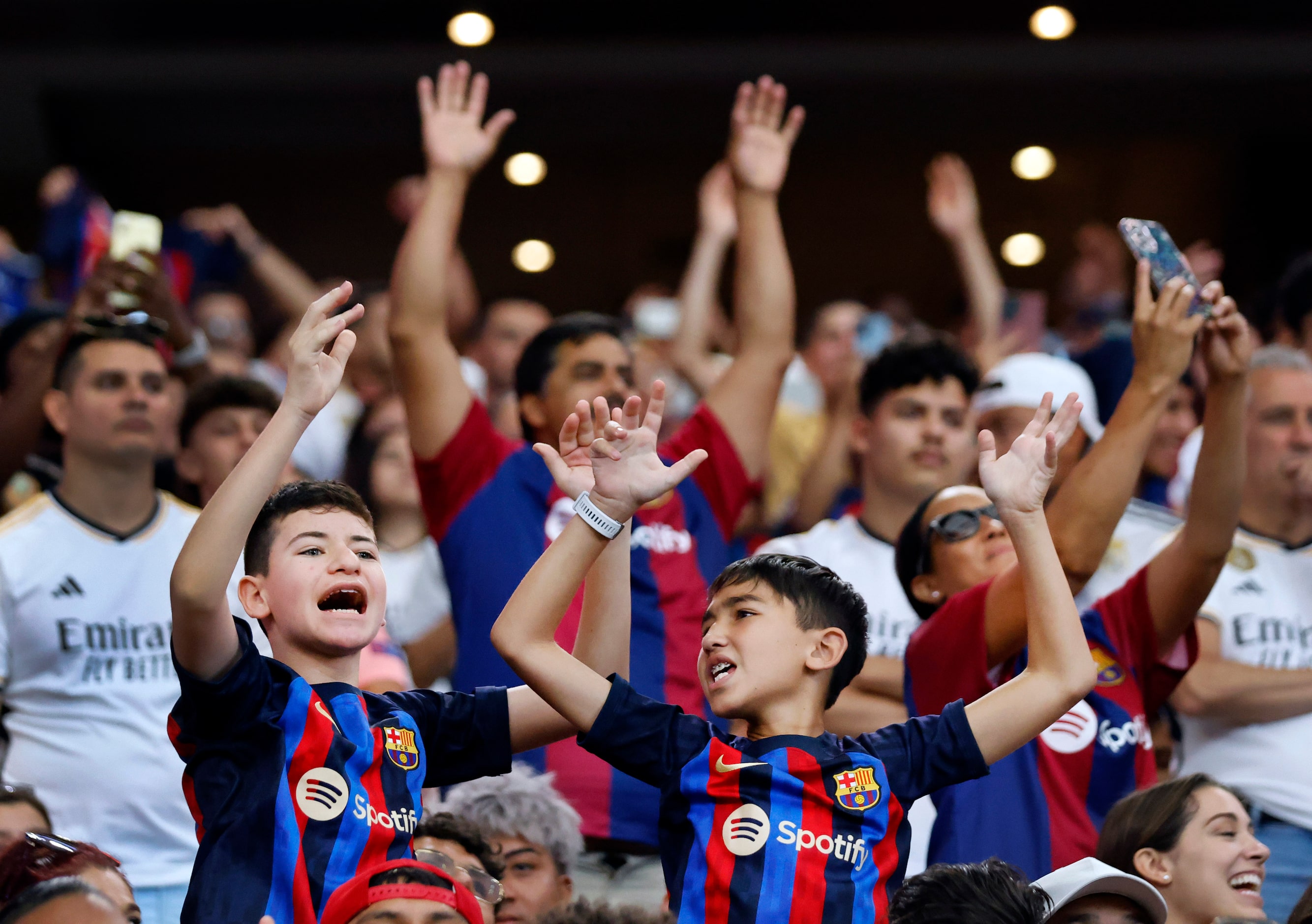 Barcelona fans celebrate their teams 3-0 win over Real Madrid in their Soccer Champions Tour...