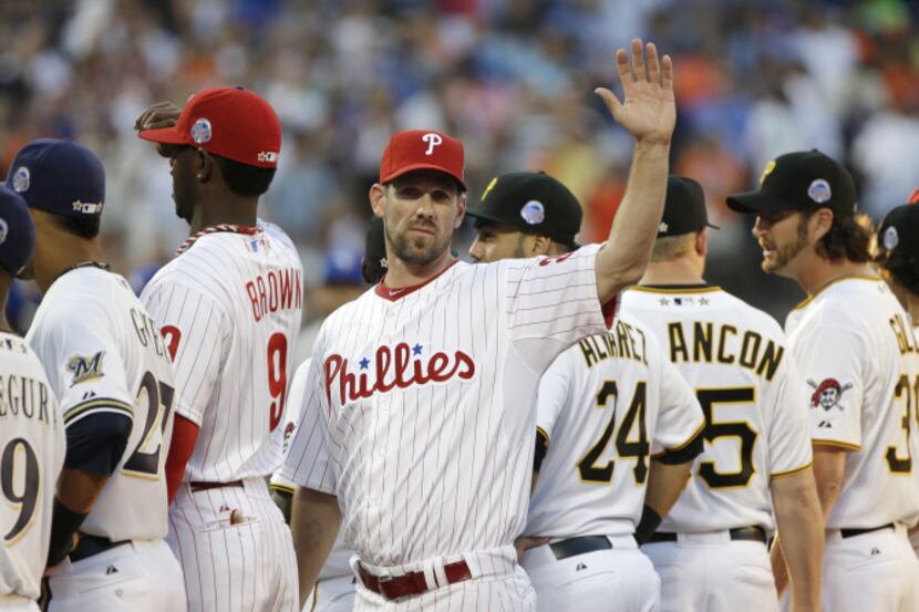 Cliff Lee, of the Philadelphia Phillies, waves to spectators during team introductions...