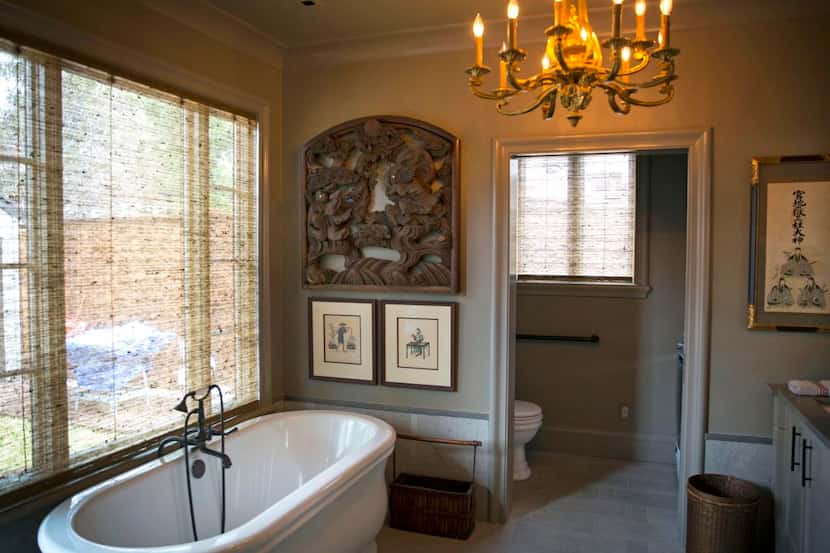 
To enlarge the bathroom, the rear wall was pushed out under the eave, creating space for a...