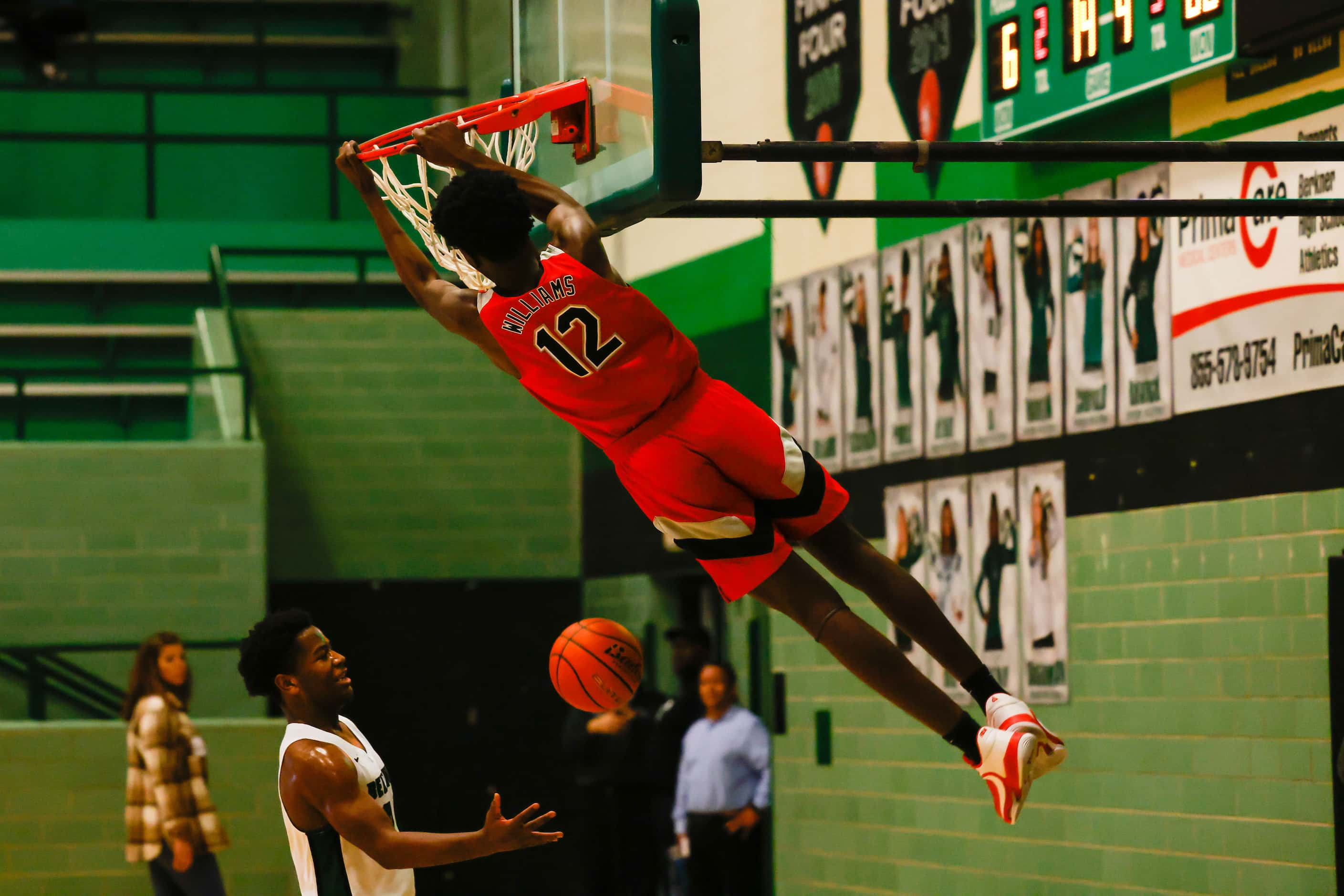 Lake Highlands High School' Jaire Williams #12 dunks the basketball during the second half...