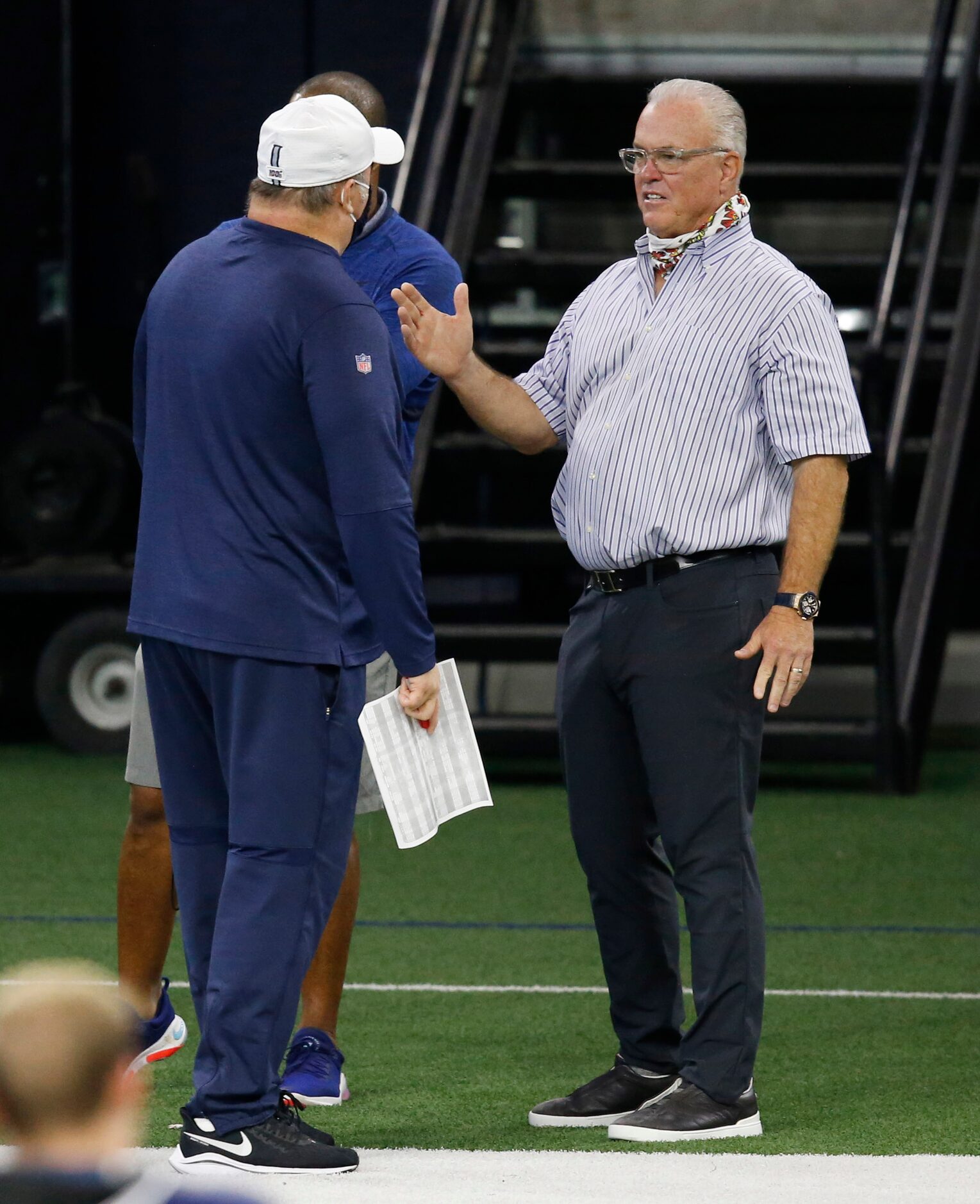 Dallas Cowboys head coach Mike McCarthy talks with Dallas Cowboys vice president of player...