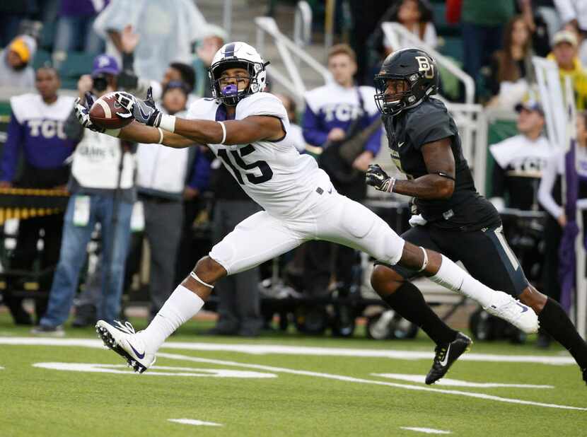 TCU Horned Frogs wide receiver Jaelan Austin (15) stretches for a catch against the Baylor...
