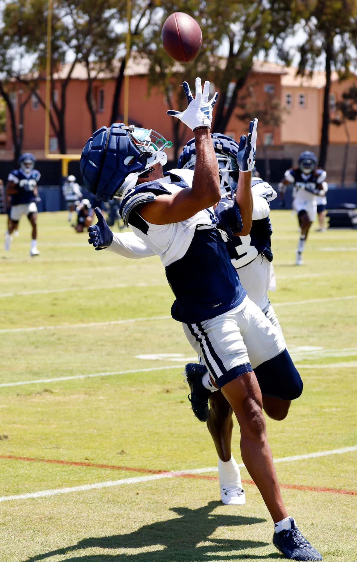 Dallas Cowboys wide receiver Jalen Tolbert (1) makes an over-the-shoulder catch against...