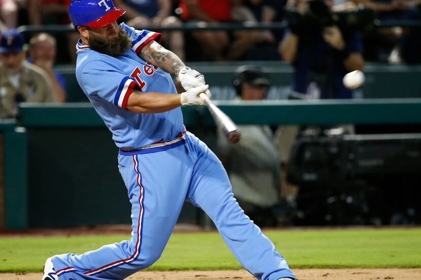 Texas Rangers first baseman Mike Napoli (5) hits a double against Los Angeles Angels during...
