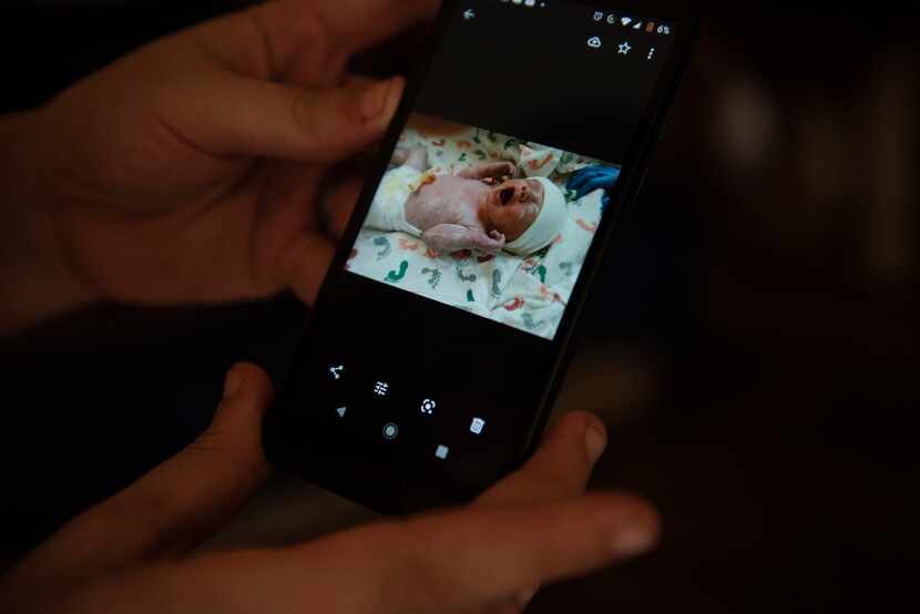 Tiffany Revilla shares a picture of her newborn daughter, Cheyenne, from her phone at her...