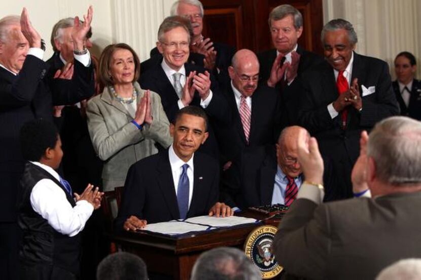 
Then-Speaker Nancy Pelosi (third from left) is among the major Democrats applauding...