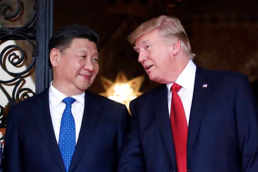 In this April 6, 2017 file photo, Chinese President Xi Jinping, left, smiles at U.S....