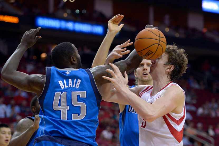 Oct 21, 2013; Houston, TX, USA; Houston Rockets center Omer Asik (3) loses control of the...