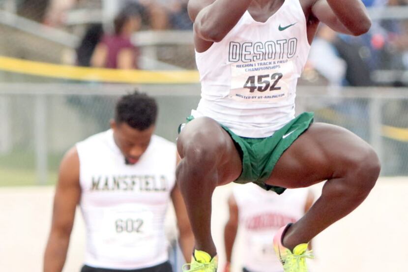 DeSoto's Donovan Smith leaps to stretch his legs before competing in the Boys 6A 4X100 relay...