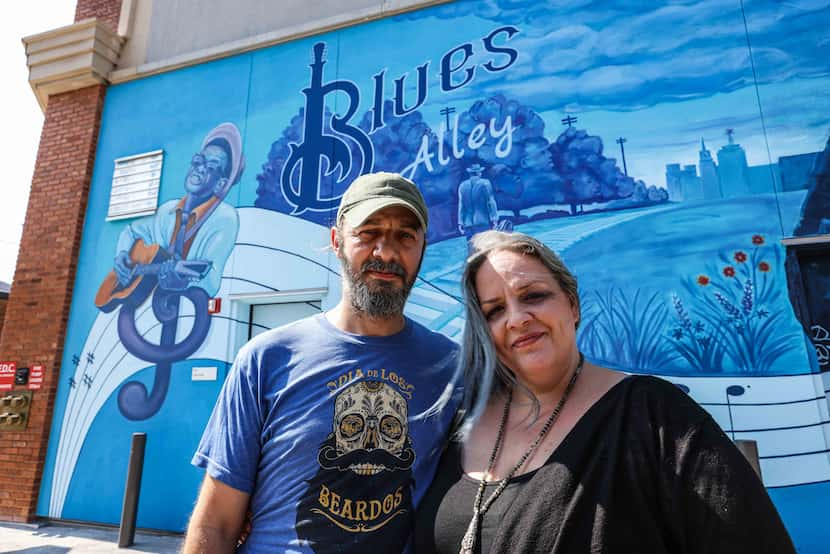 Dan and Cathryn Colcer, the curators of the project, pose in the alley in July.