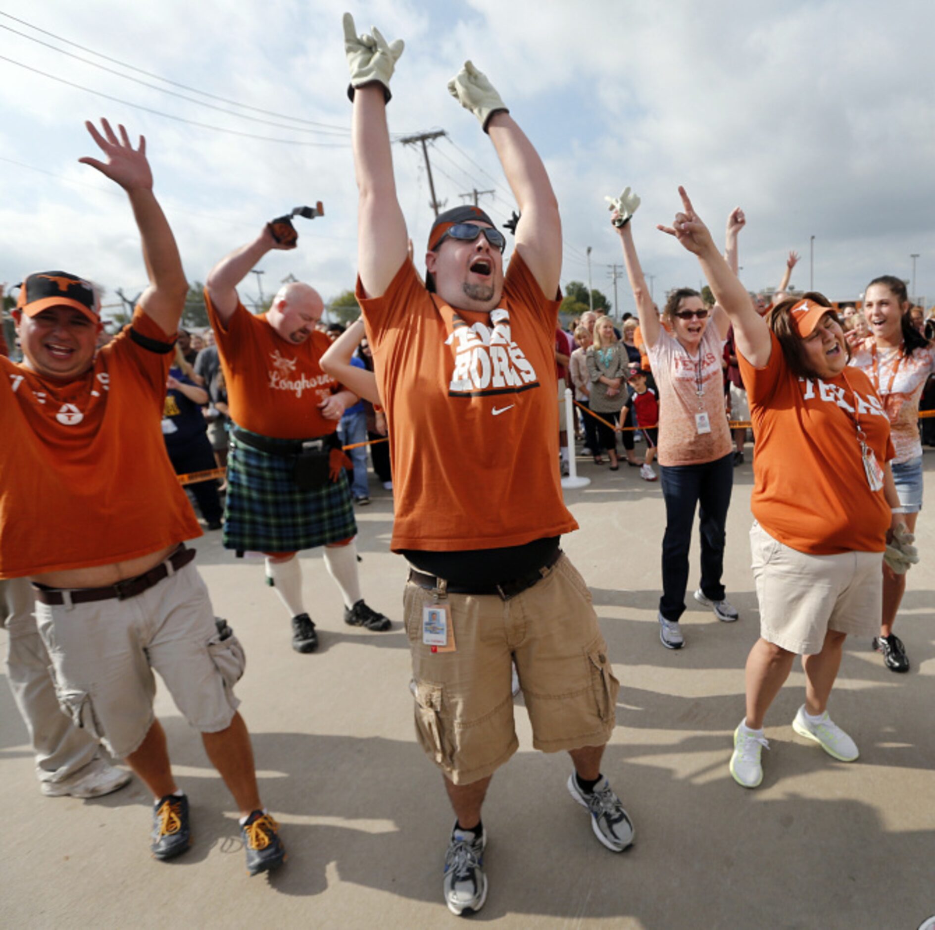 Southwest Airlines employees representing the University of Texas celebrate their win over...