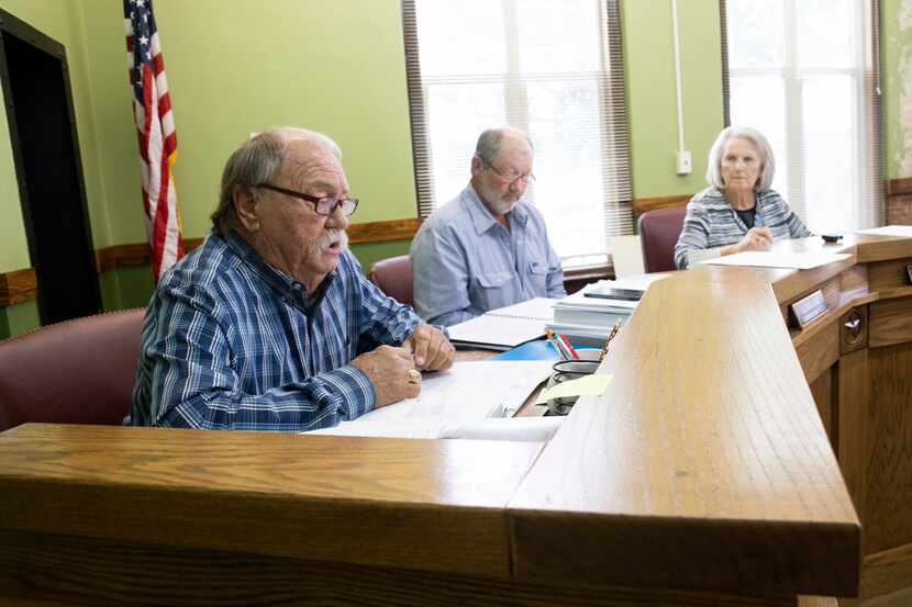 Freestone County commissioners, including Clyde Ridge Jr. (left), condemned a move by the...