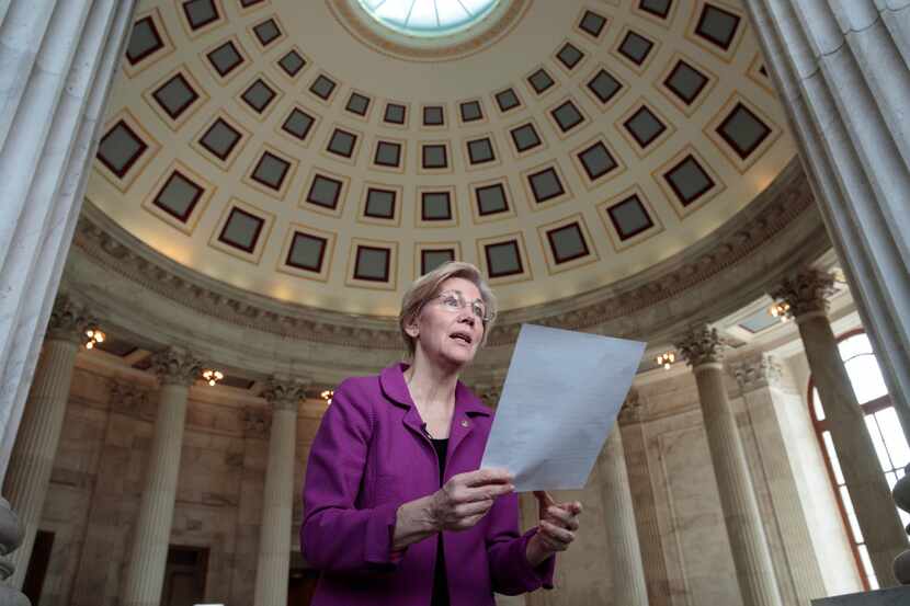 Holding a transcript of her speech in the Senate Chamber, Sen. Elizabeth Warren, D-Mass....
